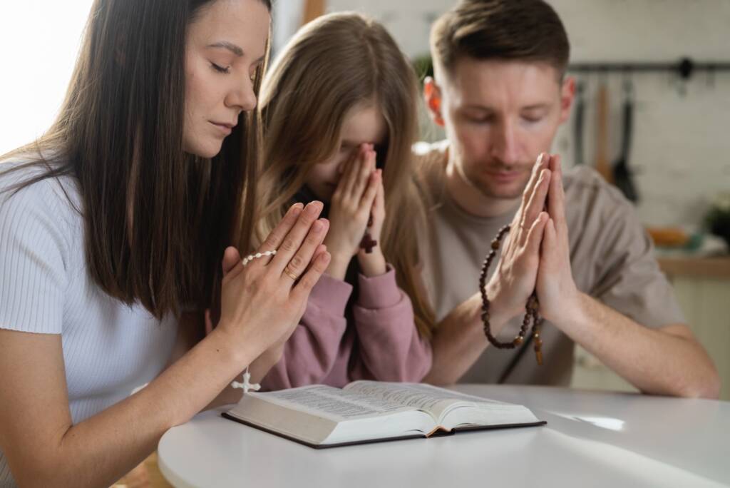 Christian family prays